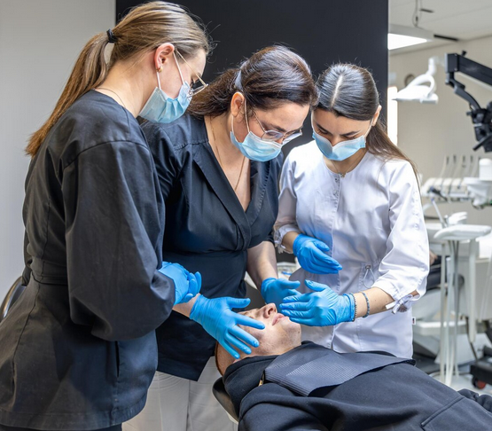 Dental team providing preventive and restorative care in a modern family dental clinic.